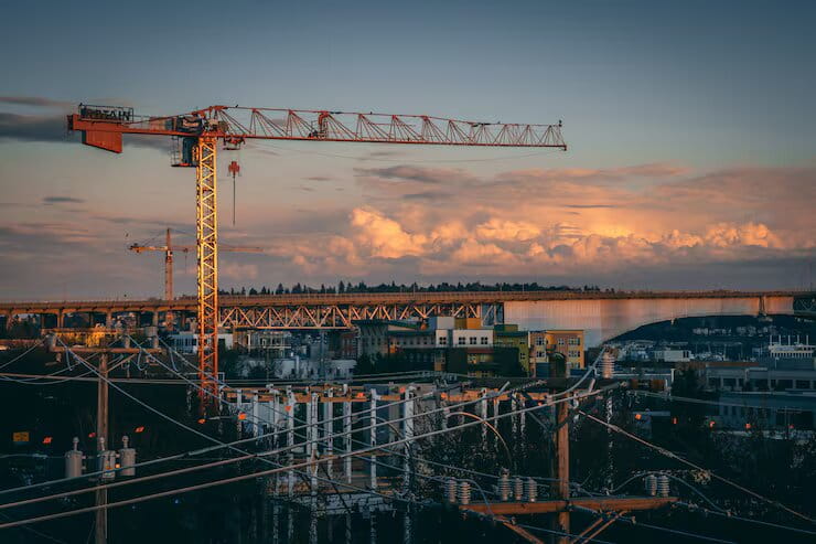 Construction site with heavy machinery and cranes for infrastructure development
